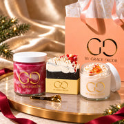 By Grace Decor Peppermint Bark gift set with handmade soap, sugar scrub and open body butter in a coordinated satin holiday scene